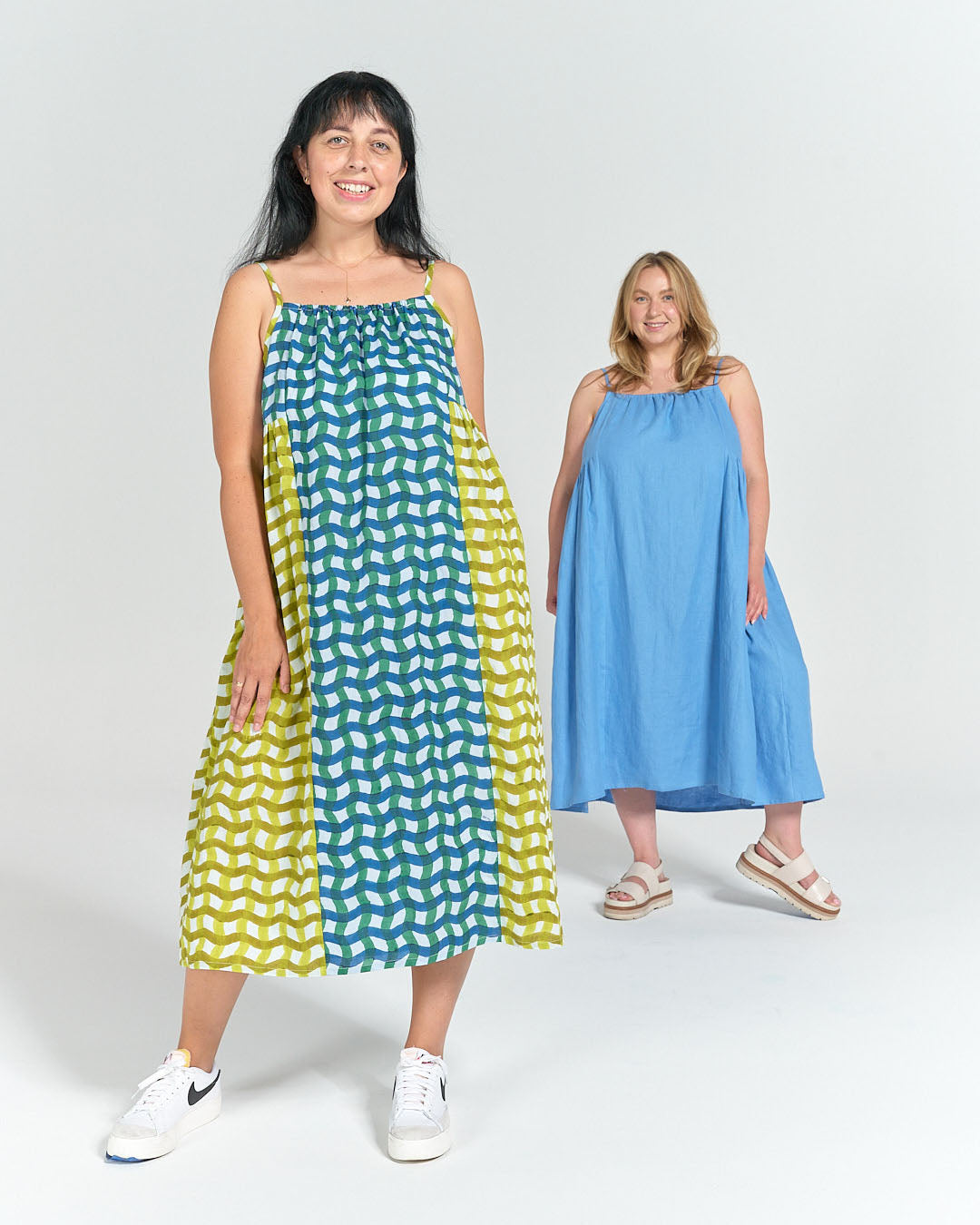 Two models wearing schoolhouse sundresses with a casual feeling