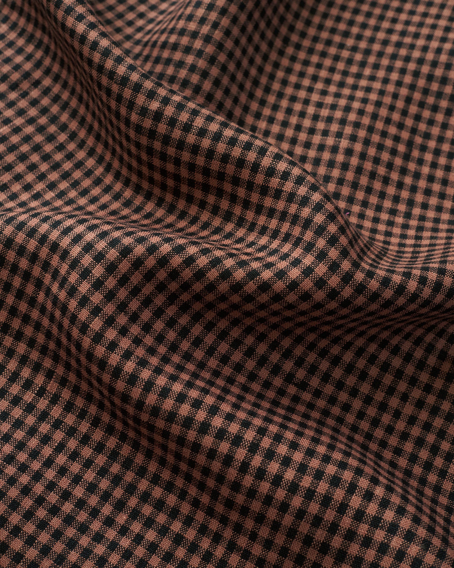 Close-up of small brown and black gingham linen fabric