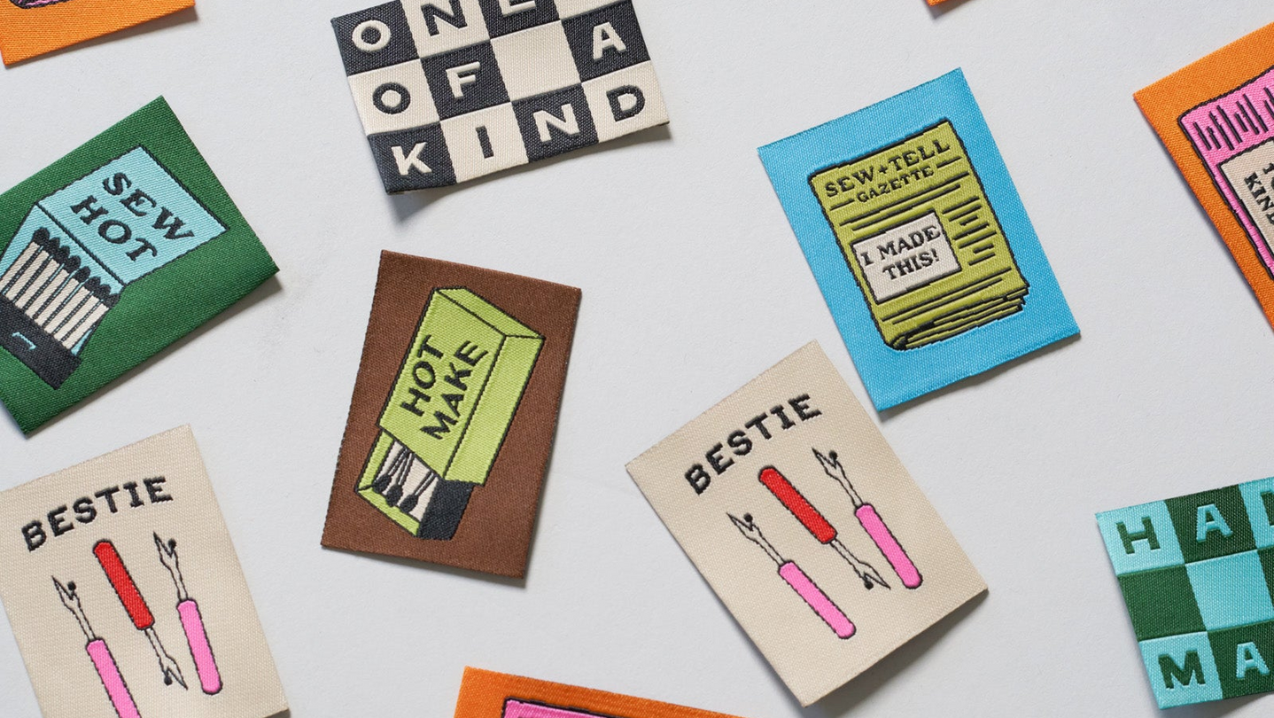 Collection of colorful labels with text and graphics on a white background