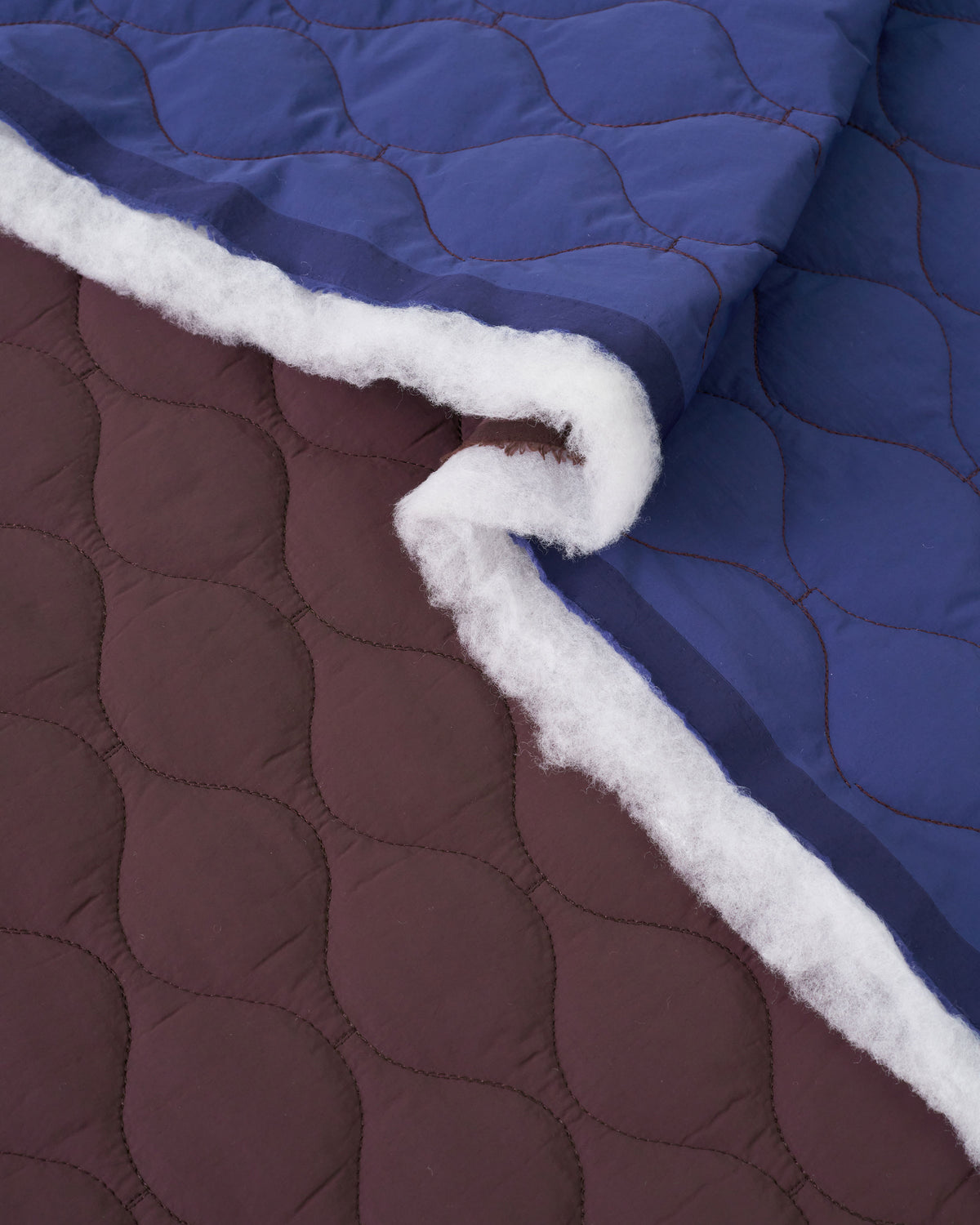 Fig Blue Wavy Quilted Puffy Nylon