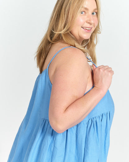 Detail of gathered side panel and soft linen drape